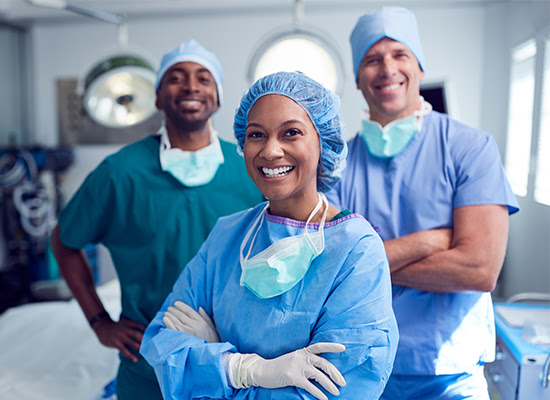 Medical professionals standing in an operating room