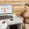 How to Prepare for Your First Endometriosis Specialist Appointment 30 a woman meeting with an endometriosis specialist in a doctor's office