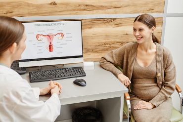 a woman meeting with an endometriosis specialist in a doctor's office