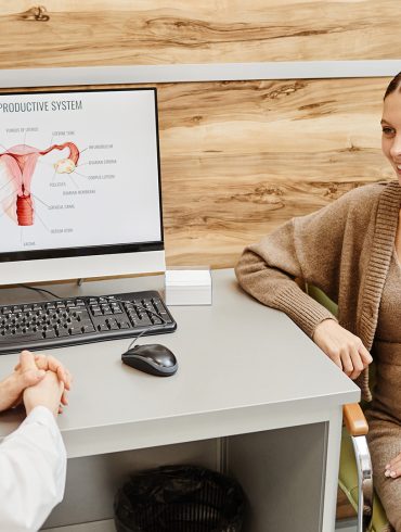 a woman meeting with an endometriosis specialist in a doctor's office